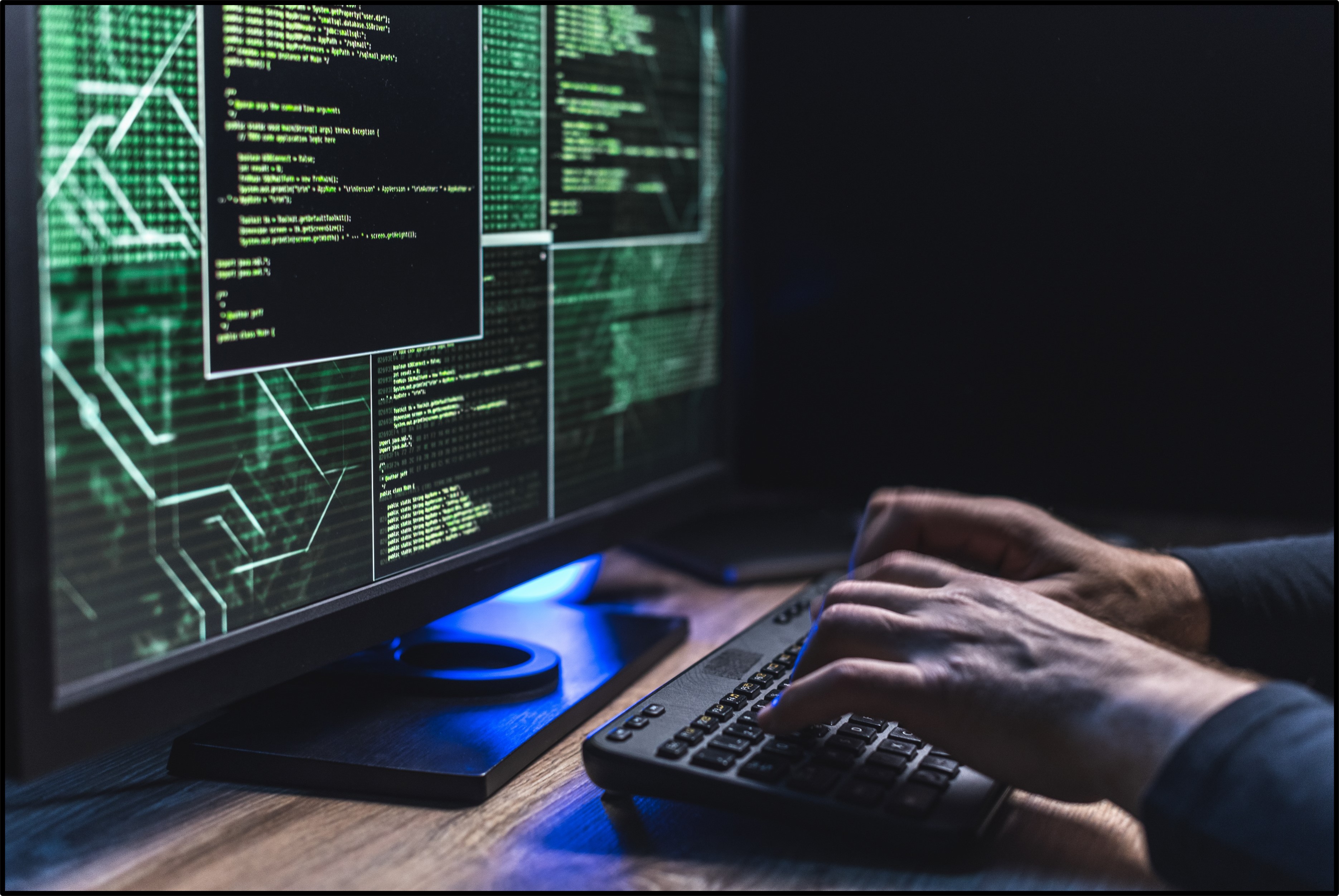 Stock image of person typing at computer