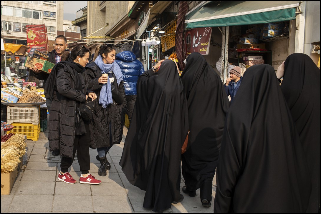 Women walking without headscarves in Tehran