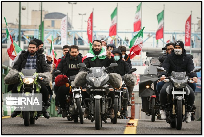 Motorcyclists in Tehran parade commemorating the anniversary of the Islamic Revolution.
